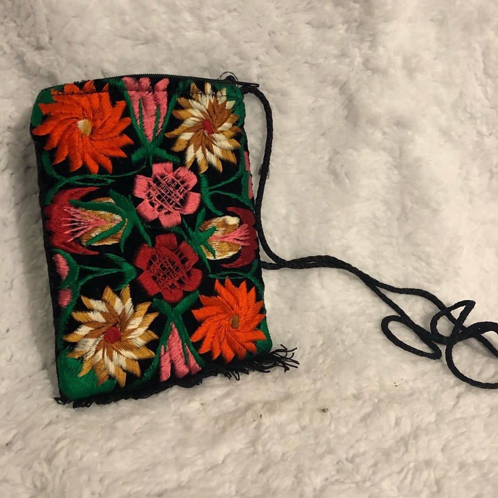 Small velour purse with bright crocheted flowers